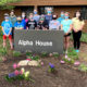 Volunteers plant a springtime ‘Welcome Home’ mat for Alpha House residents